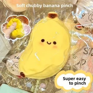 A Cute Yellow Banana Squishy Toy That Slowly Rebounds - Featuring a Sweet Smiley Face Design, Perfect As a Gift for Parties, Gatherings, Schools, And Birthdays, Suitable for Display in Various Settings.